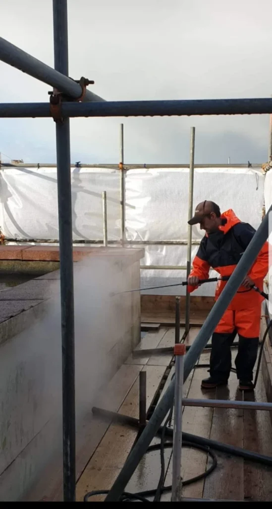 Stone cleaning on building site.