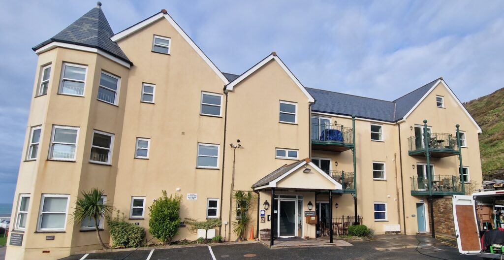 Render cleaned on building in Devon.