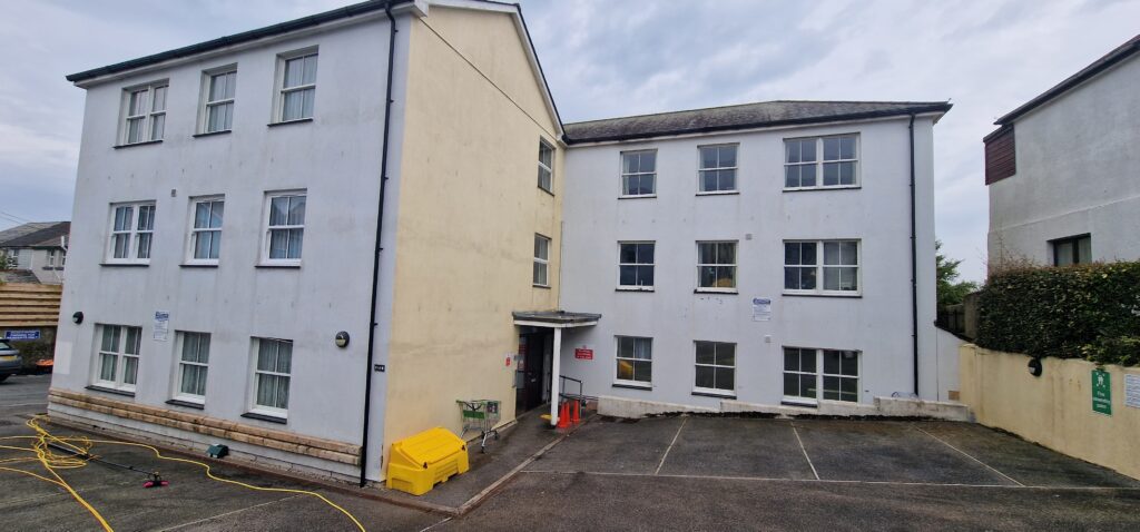 Cleaned render walls on block of flats.