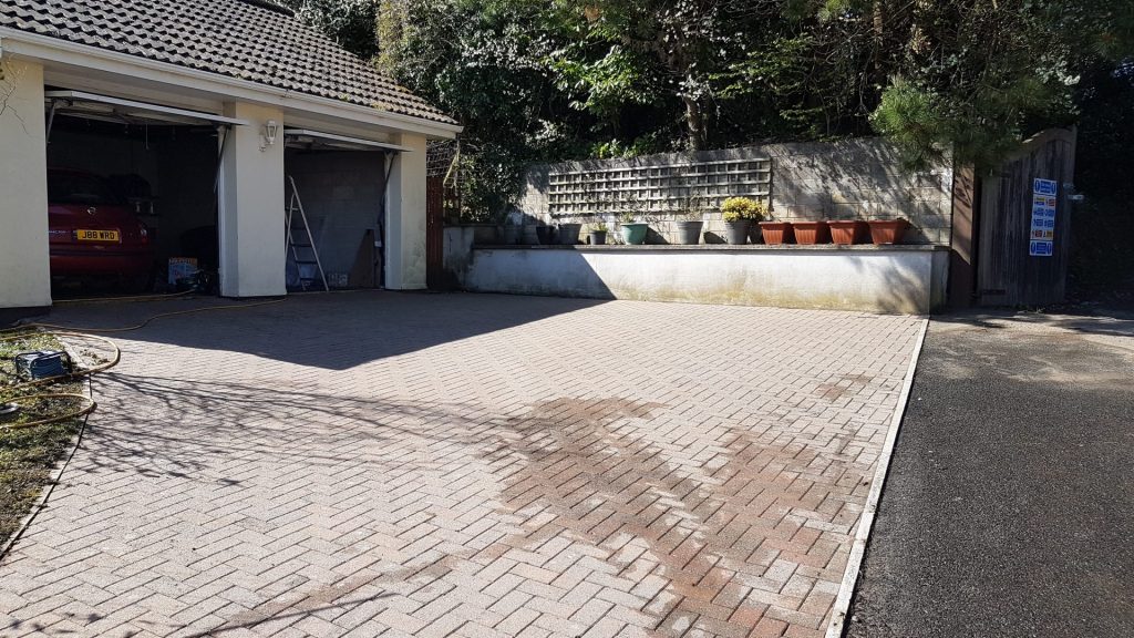 Clean driveway on property paving blocks.